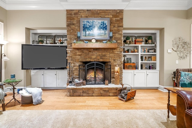 6779 Arno Allisona Rd, College Grove, TN 37046 - living area with ornamental molding, wood finished floors, and a stone fireplace