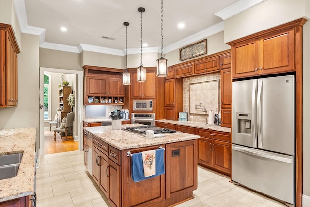 6779 Arno Allisona Rd, College Grove, TN 37046 - kitchen featuring stainless steel appliances, backsplash, brown cabinets, a center island, and crown molding