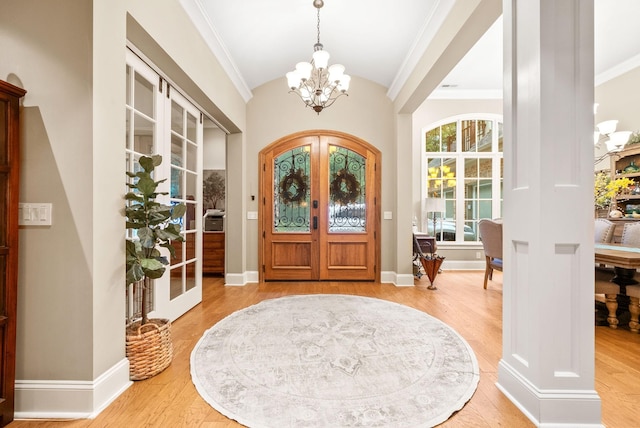 6779 Arno Allisona Rd, College Grove, TN 37046 - entrance foyer with french doors, a chandelier, wood finished floors, lofted ceiling, and ornamental molding