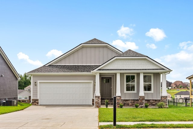 1573 Collins View Way, Clarksville, TN 37043 - craftsman-style house with board and batten siding, stone siding, concrete driveway, an attached garage, and a shingled roof