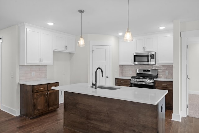 1573 Collins View Way, Clarksville, TN 37043 - kitchen with appliances with stainless steel finishes, a sink, dark wood-style flooring, white cabinets, and recessed lighting
