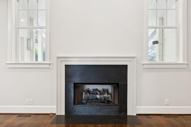 286 Keswick Grove Ln, Franklin, TN 37067 - detailed view of a fireplace with flush hearth, baseboards, and wood finished floors