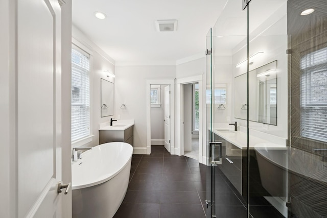 286 Keswick Grove Ln, Franklin, TN 37067 - full bath with vanity, a freestanding bath, baseboards, ornamental molding, and tile patterned floors