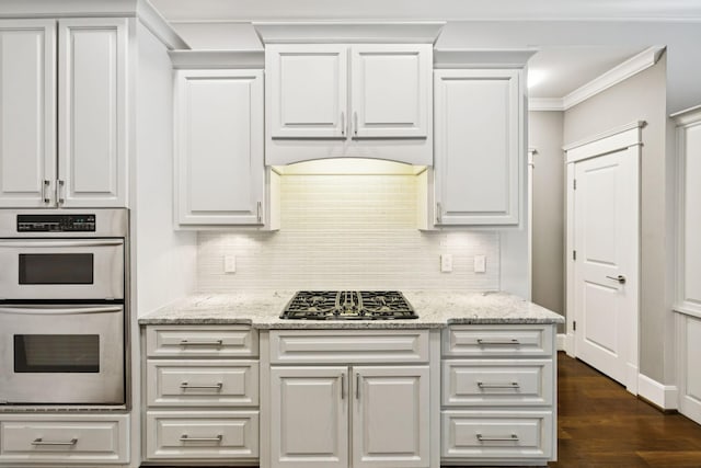 286 Keswick Grove Ln, Franklin, TN 37067 - kitchen featuring double oven, gas stovetop, backsplash, white cabinetry, and crown molding