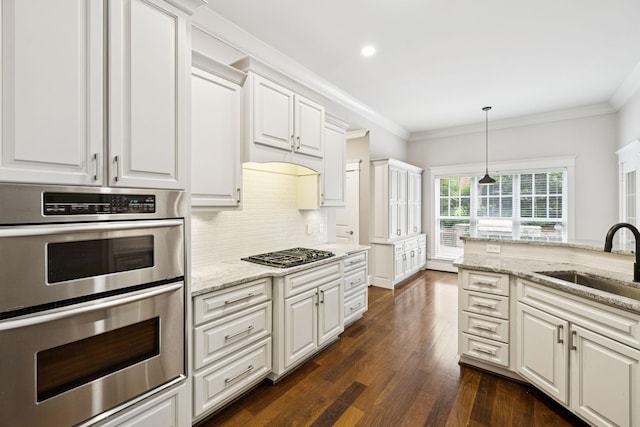 286 Keswick Grove Ln, Franklin, TN 37067 - kitchen with stainless steel double oven, a sink, dark wood-type flooring, gas cooktop, and white cabinetry