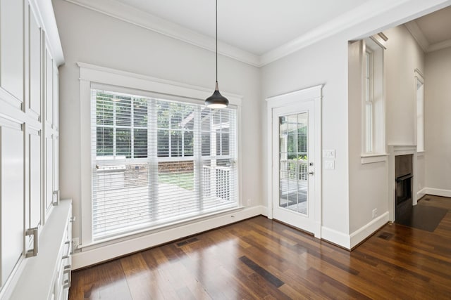 286 Keswick Grove Ln, Franklin, TN 37067 - unfurnished dining area with dark wood-style floors, crown molding, a fireplace, and baseboards