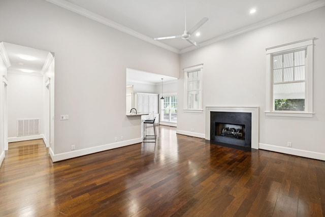 286 Keswick Grove Ln, Franklin, TN 37067 - unfurnished living room featuring ceiling fan, dark wood-type flooring, crown molding, a fireplace with flush hearth, and baseboards