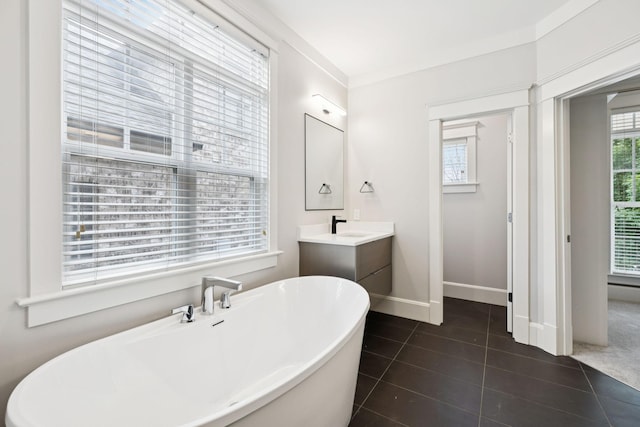 286 Keswick Grove Ln, Franklin, TN 37067 - bathroom featuring a freestanding bath, tile patterned floors, vanity, and baseboards