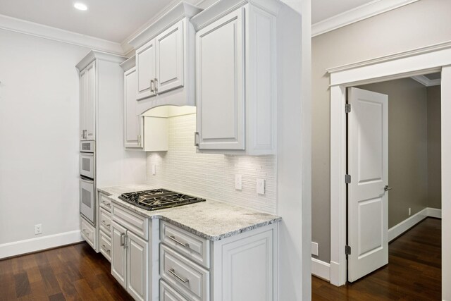 286 Keswick Grove Ln, Franklin, TN 37067 - kitchen with gas stovetop, decorative backsplash, baseboards, ornamental molding, and dark wood-style floors