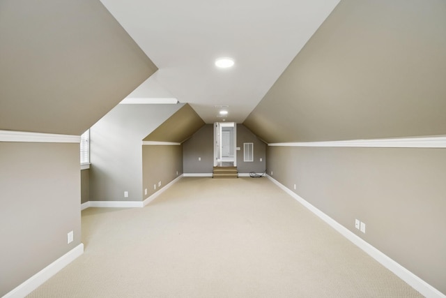 286 Keswick Grove Ln, Franklin, TN 37067 - additional living space with vaulted ceiling, baseboards, and light carpet