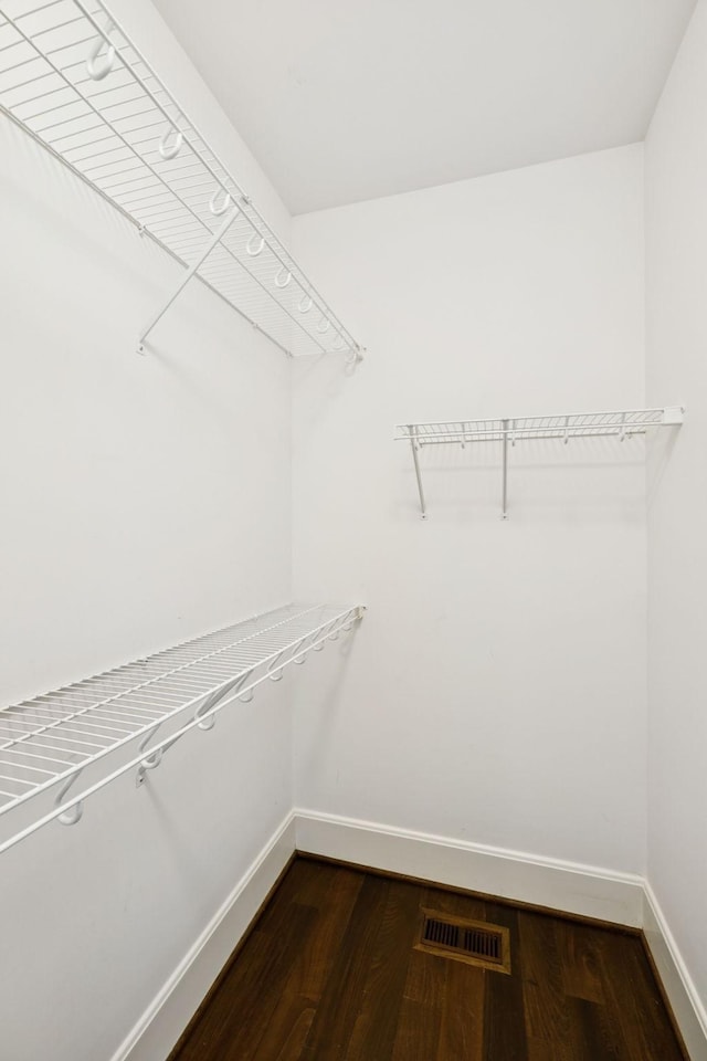 286 Keswick Grove Ln, Franklin, TN 37067 - spacious closet featuring dark wood-type flooring