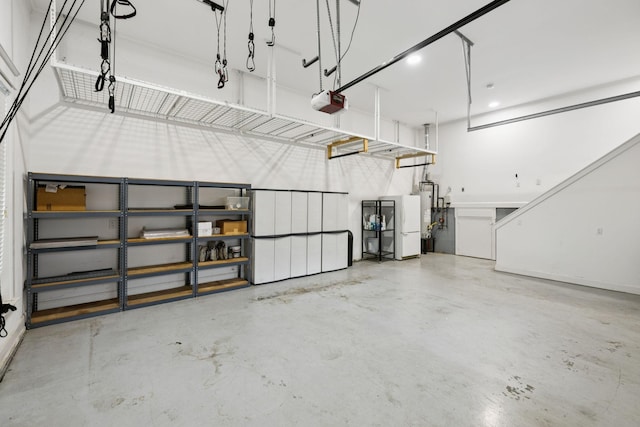 286 Keswick Grove Ln, Franklin, TN 37067 - garage featuring a garage door opener and water heater