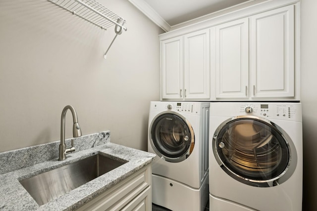 286 Keswick Grove Ln, Franklin, TN 37067 - laundry room with cabinet space, washing machine and clothes dryer, and ornamental molding
