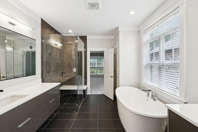 286 Keswick Grove Ln, Franklin, TN 37067 - bathroom with vanity, a stall shower, a freestanding tub, tile patterned floors, and recessed lighting