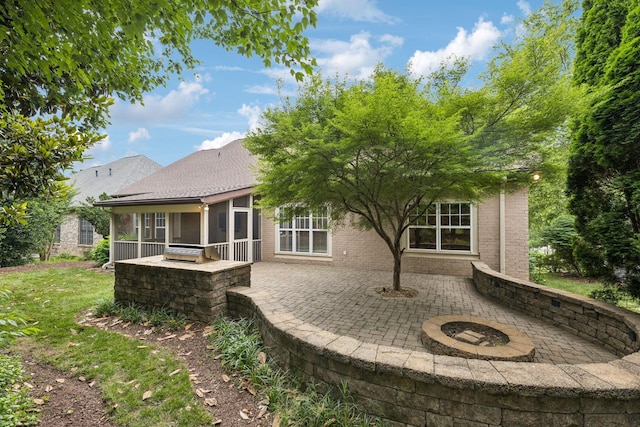286 Keswick Grove Ln, Franklin, TN 37067 - back of property featuring a patio area, a sunroom, and a shingled roof