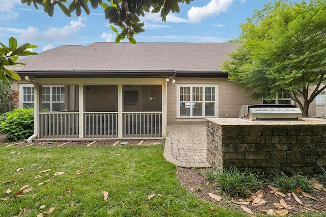 286 Keswick Grove Ln, Franklin, TN 37067 - rear view of property with exterior kitchen, a yard, a sunroom, brick siding, and a shingled roof