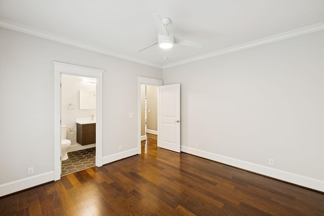 286 Keswick Grove Ln, Franklin, TN 37067 - unfurnished bedroom featuring crown molding, dark wood finished floors, baseboards, ensuite bath, and a sink
