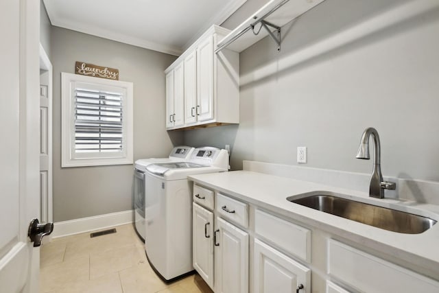 1194 Meadow Bridge Ln, Arrington, TN 37014 - laundry area with cabinet space, washer and dryer, light tile patterned flooring, and baseboards