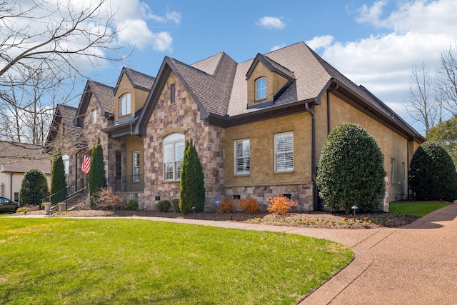 1194 Meadow Bridge Ln, Arrington, TN 37014 - view of front facade featuring a front yard, stone siding, and a shingled roof