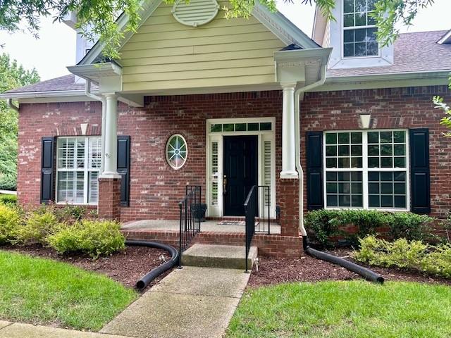 1906 Montgomery Way, Franklin, TN 37067 - doorway to property featuring brick siding and a chimney