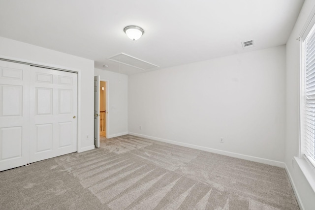 1906 Montgomery Way, Franklin, TN 37067 - unfurnished bedroom featuring attic access, carpet flooring, and a closet
