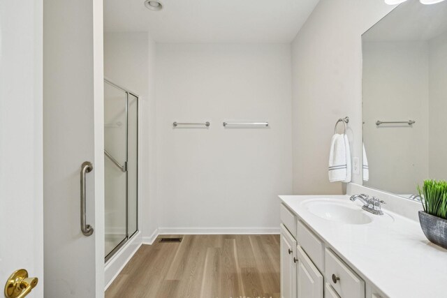 1906 Montgomery Way, Franklin, TN 37067 - bathroom featuring wood finished floors, vanity, and a shower stall