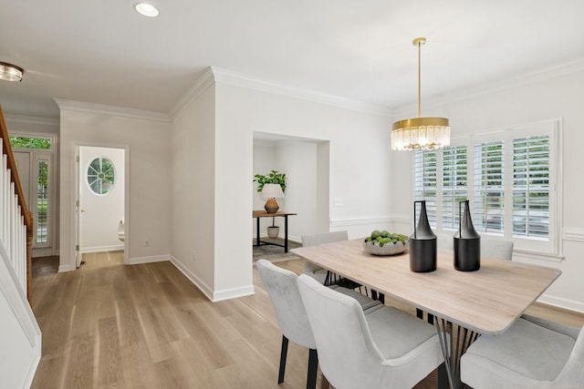1906 Montgomery Way, Franklin, TN 37067 - dining area featuring plenty of natural light, a chandelier, crown molding, light wood-type flooring, and stairs
