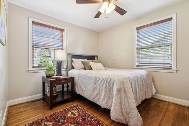 4202 Murphy Rd, Nashville, TN 37209 - bedroom featuring multiple windows, baseboards, wood finished floors, and ceiling fan
