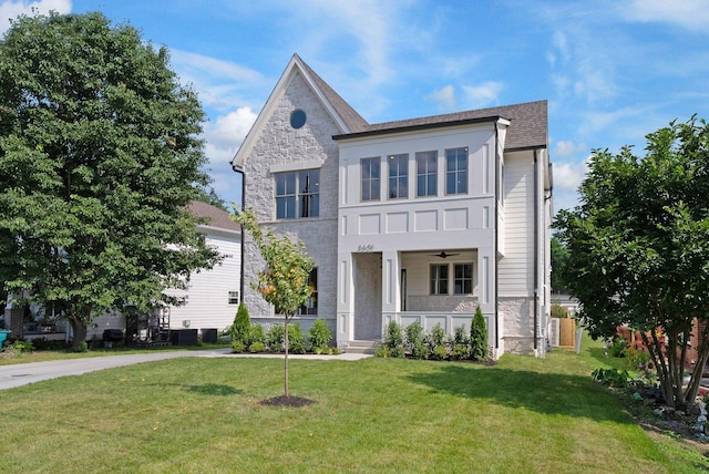 3601 Nebraska Ave, Nashville, TN 37209 - view of front facade featuring stone siding, covered porch, a front yard, ceiling fan, and a shingled roof