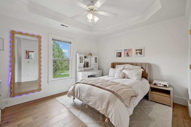 205 Well Spring Ct, Brentwood, TN 37027 - bedroom with a tray ceiling, light wood-type flooring, crown molding, and ceiling fan