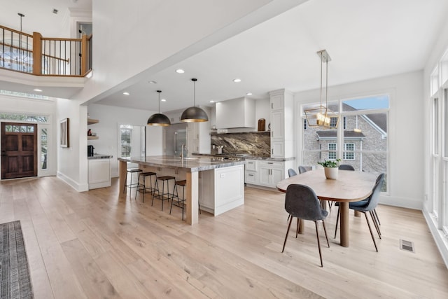 205 Well Spring Ct, Brentwood, TN 37027 - dining area featuring light wood-type flooring, baseboards, a chandelier, and recessed lighting