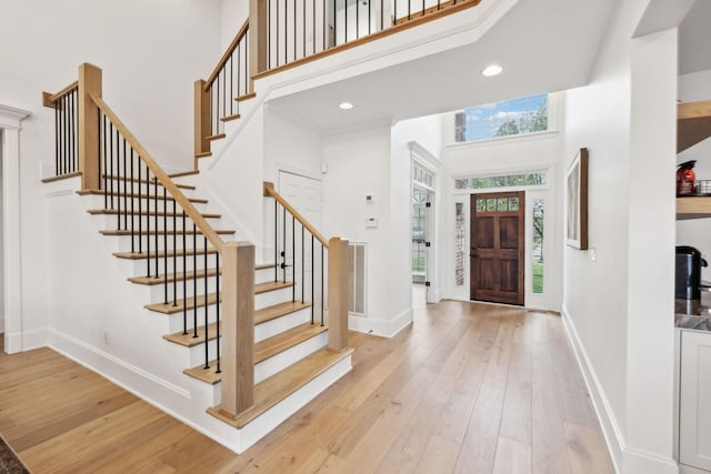 205 Well Spring Ct, Brentwood, TN 37027 - foyer featuring a towering ceiling, healthy amount of natural light, light wood-style floors, stairway, and recessed lighting
