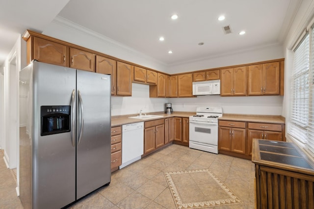 205 Well Spring Ct, Brentwood, TN 37027 - kitchen featuring white appliances, a sink, ornamental molding, plenty of natural light, and light countertops