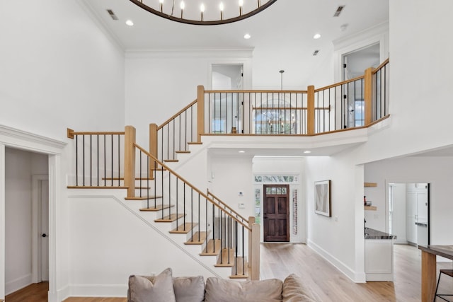 205 Well Spring Ct, Brentwood, TN 37027 - foyer entrance with wood finished floors, stairway, a high ceiling, ornamental molding, and recessed lighting
