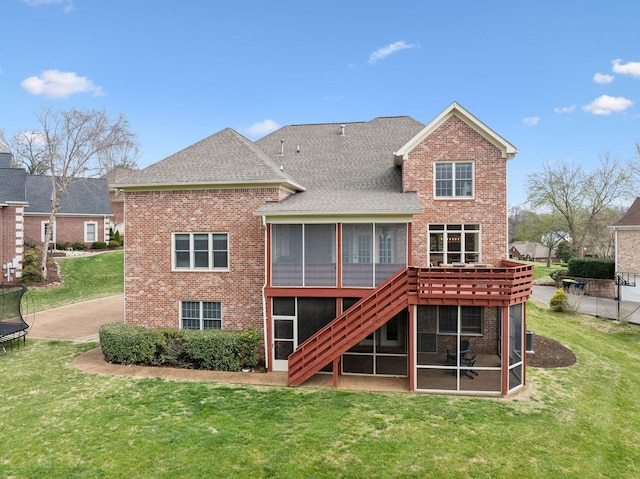 205 Well Spring Ct, Brentwood, TN 37027 - back of house featuring a sunroom, brick siding, roof with shingles, and a yard