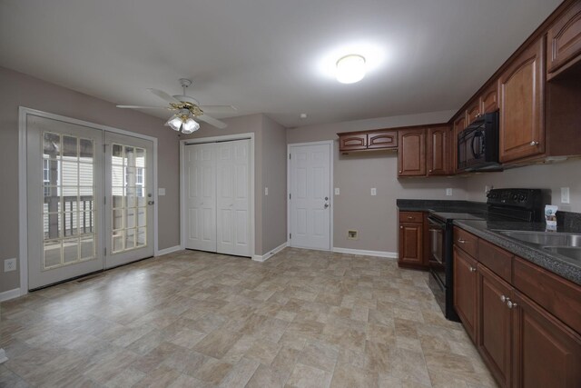 2321 Riverway Dr, Old Hickory, TN 37138 - kitchen with black appliances, dark countertops, baseboards, ceiling fan, and stone finish flooring