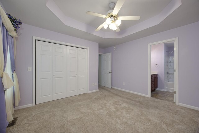 2321 Riverway Dr, Old Hickory, TN 37138 - unfurnished bedroom with carpet, a tray ceiling, a closet, and baseboards