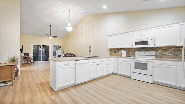395 Devon Chase Hl Unit 5103, Gallatin, TN 37066 - kitchen with white appliances, a sink, a peninsula, high vaulted ceiling, and tasteful backsplash