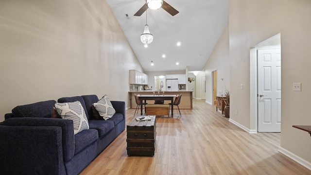 395 Devon Chase Hl Unit 5103, Gallatin, TN 37066 - living room featuring high vaulted ceiling, ceiling fan, light wood-style floors, and baseboards