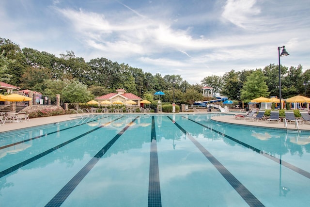 602 Pemberton Ct, Mount Juliet, TN 37122 - community pool featuring a water slide, view of wooded area, and a patio