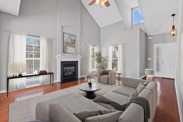 602 Pemberton Ct, Mount Juliet, TN 37122 - living area featuring high vaulted ceiling, a ceiling fan, plenty of natural light, a fireplace with flush hearth, and baseboards