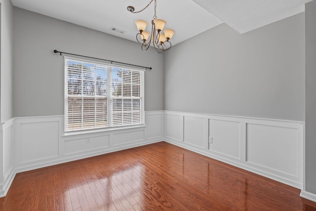 602 Pemberton Ct, Mount Juliet, TN 37122 - empty room featuring a chandelier, a wainscoted wall, and hardwood / wood-style floors