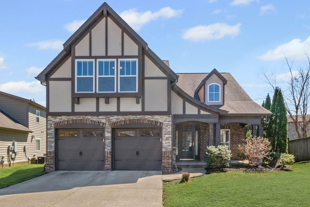 602 Pemberton Ct, Mount Juliet, TN 37122 - tudor house with concrete driveway, a front lawn, stucco siding, and a garage