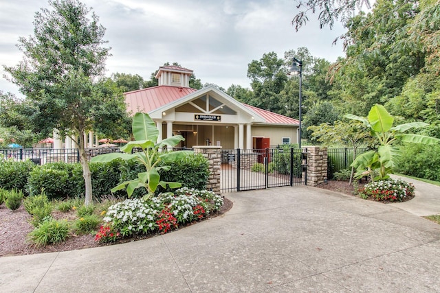 602 Pemberton Ct, Mount Juliet, TN 37122 - view of front of house with metal roof, a gate, and a standing seam roof