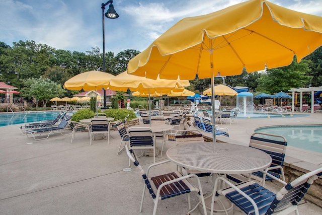 602 Pemberton Ct, Mount Juliet, TN 37122 - view of patio featuring a community pool and view of wooded area