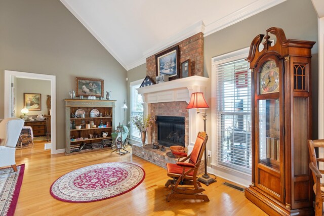 500 Forrest Park Cir, Franklin, TN 37064 - living area featuring ornamental molding, wood finished floors, a brick fireplace, and high vaulted ceiling