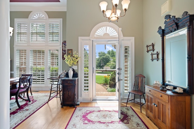 500 Forrest Park Cir, Franklin, TN 37064 - foyer entrance with a towering ceiling, a chandelier, plenty of natural light, and light wood-style floors