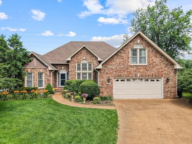 500 Forrest Park Cir, Franklin, TN 37064 - traditional home with concrete driveway, brick siding, a front lawn, roof with shingles, and a garage