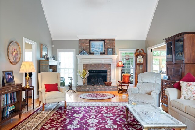 500 Forrest Park Cir, Franklin, TN 37064 - living room with a fireplace, wood finished floors, healthy amount of natural light, ornamental molding, and high vaulted ceiling