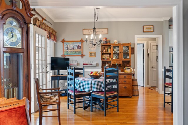 500 Forrest Park Cir, Franklin, TN 37064 - dining room with a chandelier, light wood-style floors, and ornamental molding